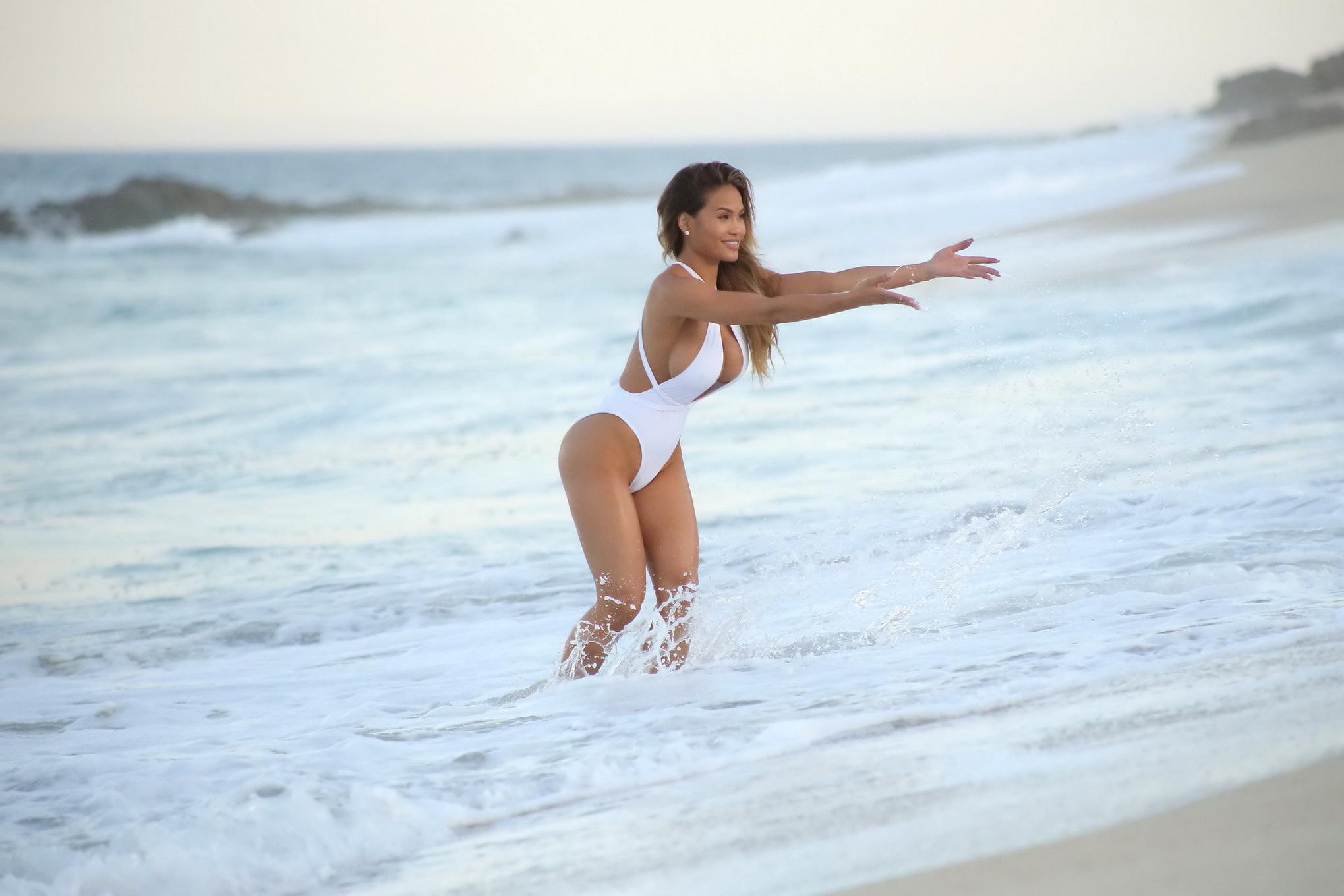 16P Daphne Joy shows off her huge boobs in tiny white swimsuit
