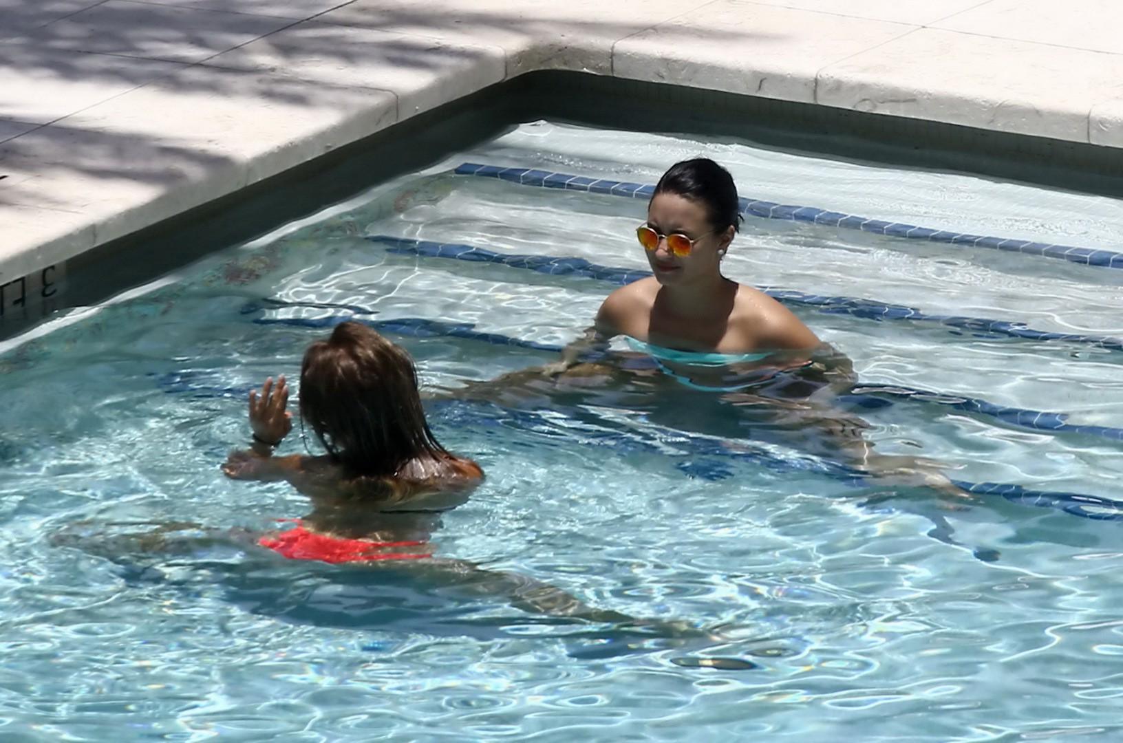16P Demi Lovato shows off her ass in a bright blue bikini