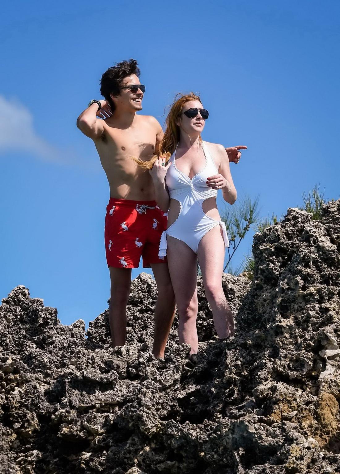16P Lindsay Lohan busty showing pokies in white swimsuit