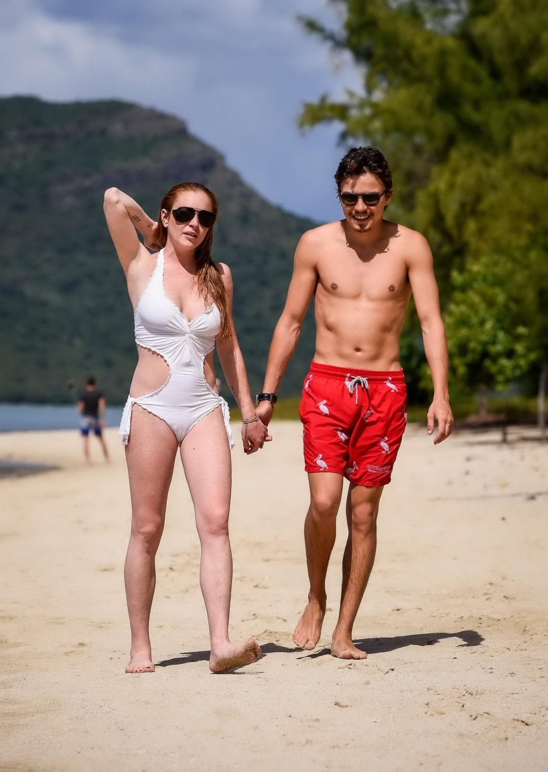 16P Lindsay Lohan busty showing pokies in white swimsuit