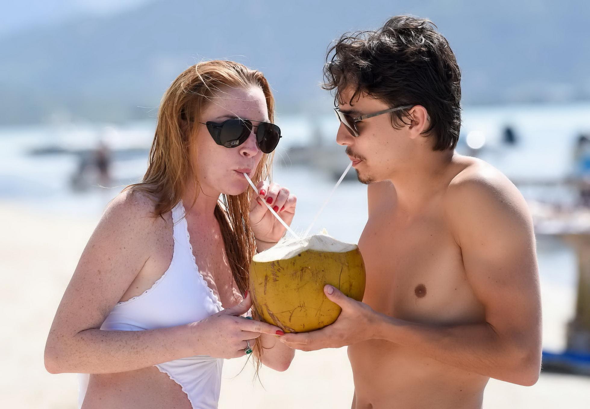 16P Lindsay Lohan busty showing pokies in white swimsuit