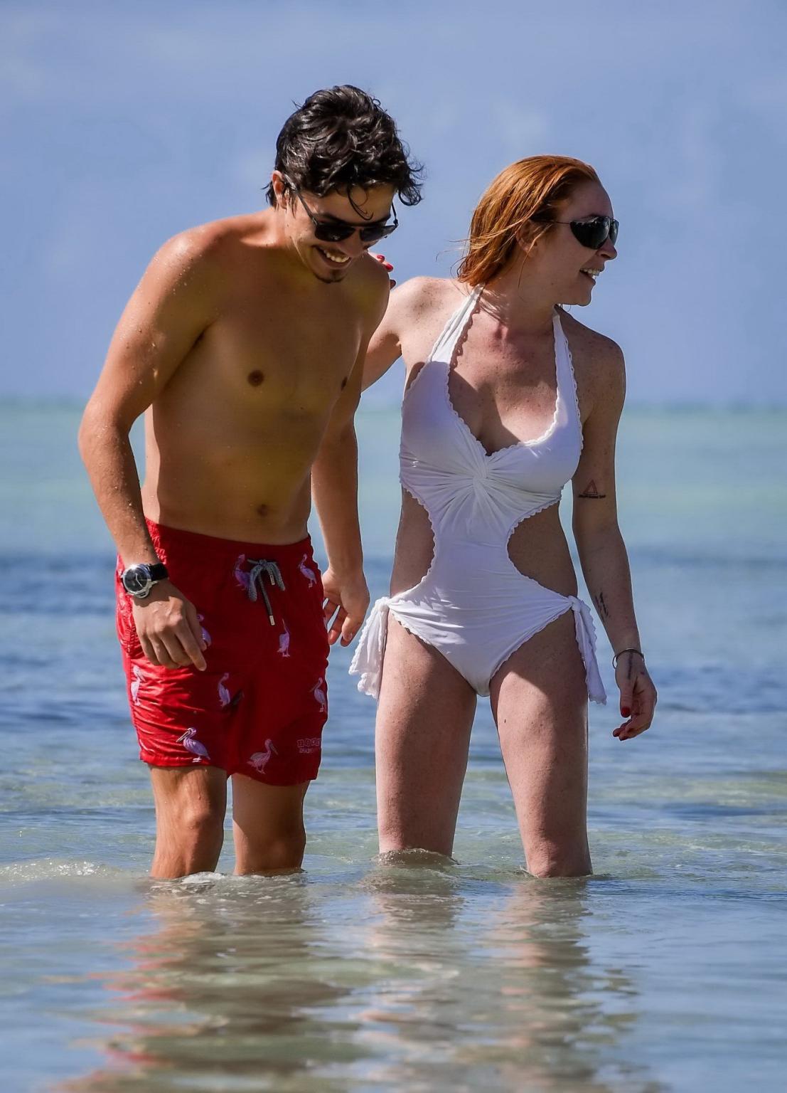 16P Lindsay Lohan busty showing pokies in white swimsuit