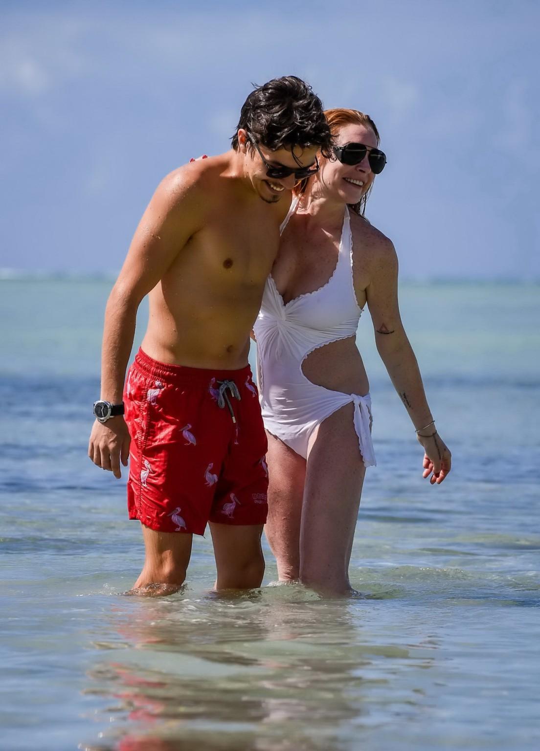16P Lindsay Lohan busty showing pokies in white swimsuit
