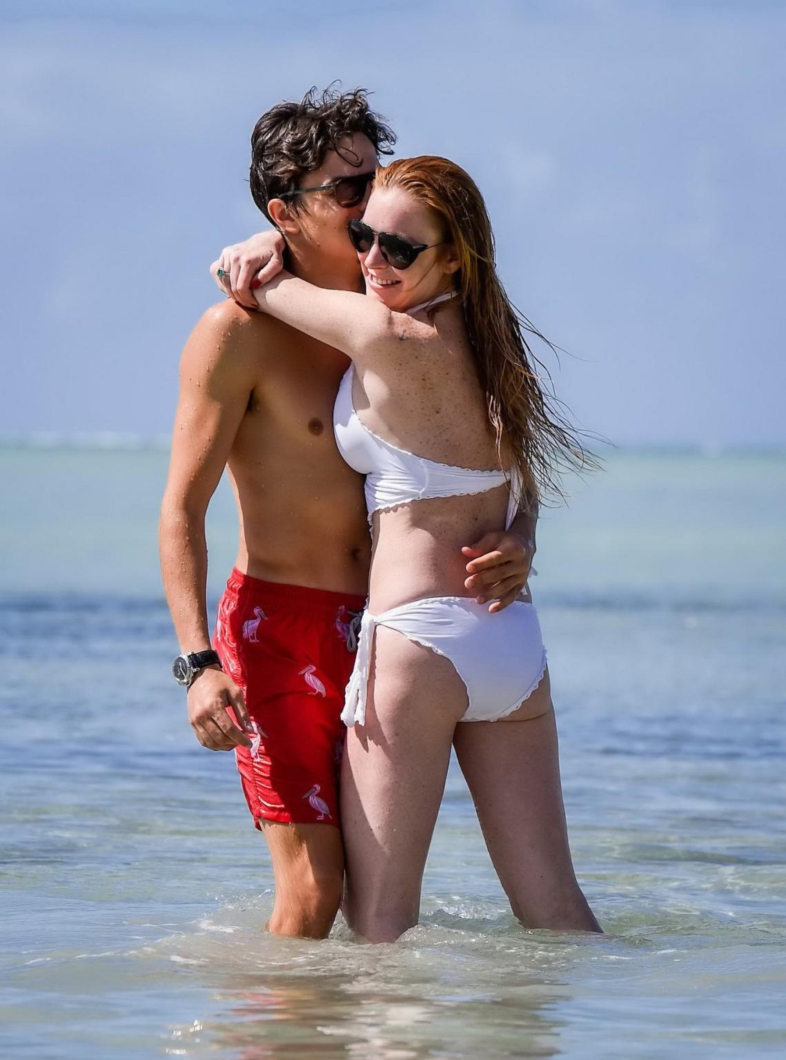 16P Lindsay Lohan busty showing pokies in white swimsuit