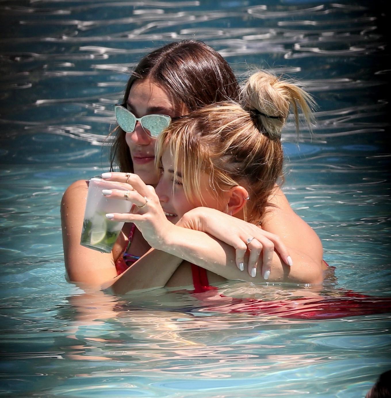 16P Hailey Baldwin showing pokies in red swimsuit