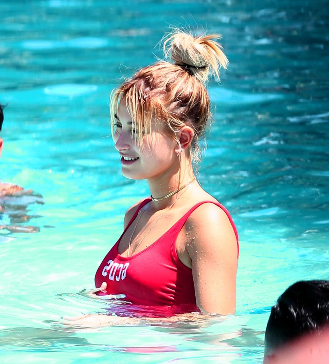 16P Hailey Baldwin showing pokies in red swimsuit