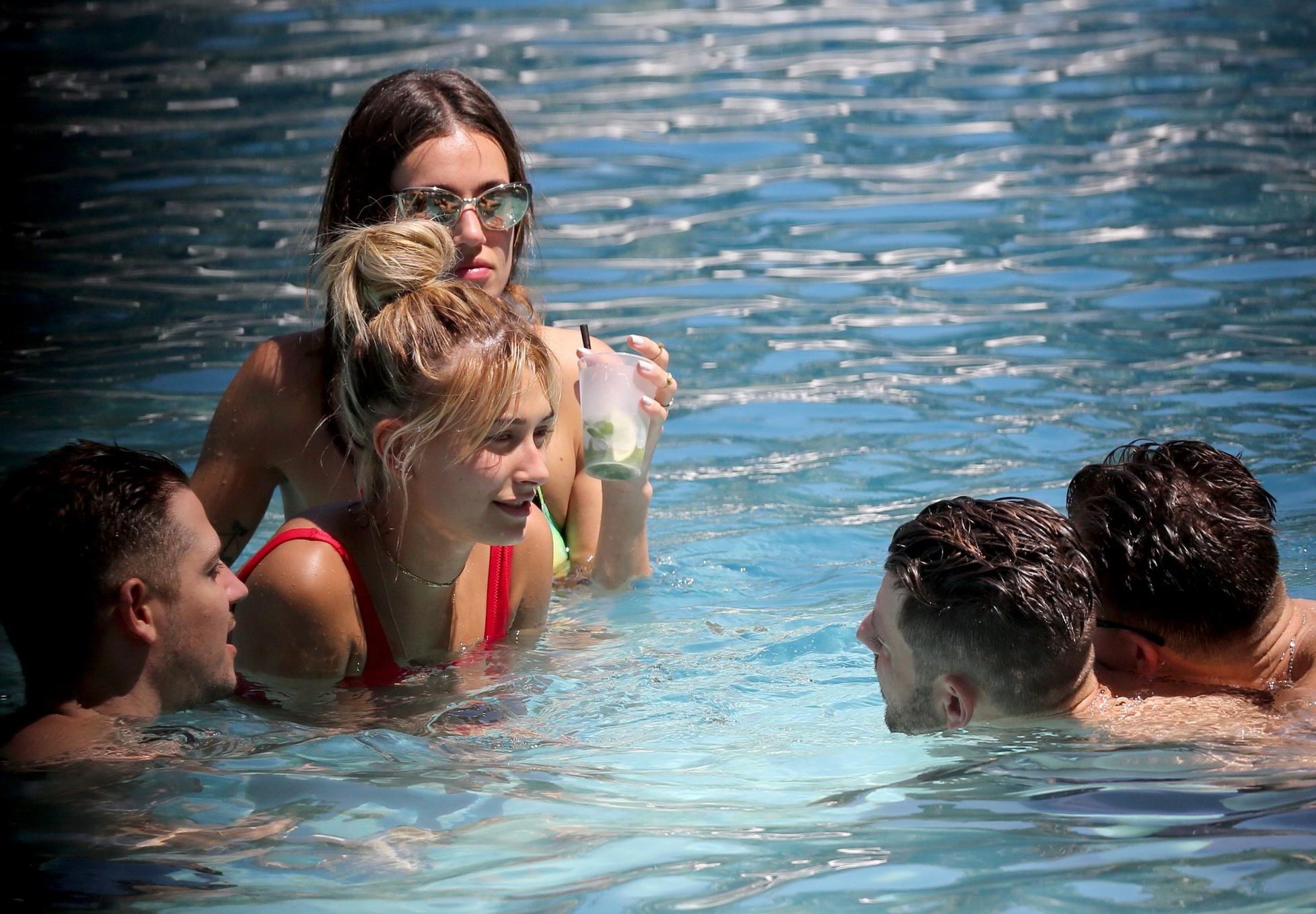 16P Hailey Baldwin showing pokies in red swimsuit