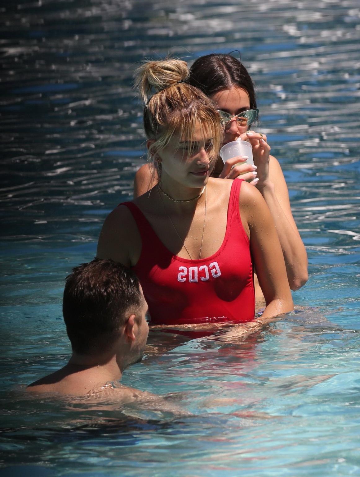 16P Hailey Baldwin showing pokies in red swimsuit