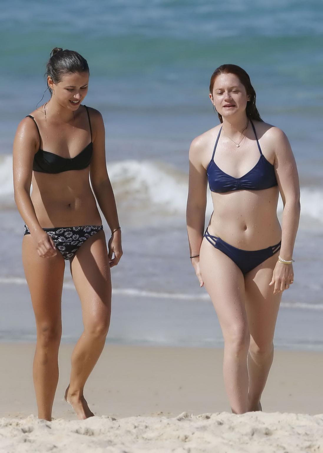 16P Bonnie Wright shows nipple pokies and ass in a blue bikini