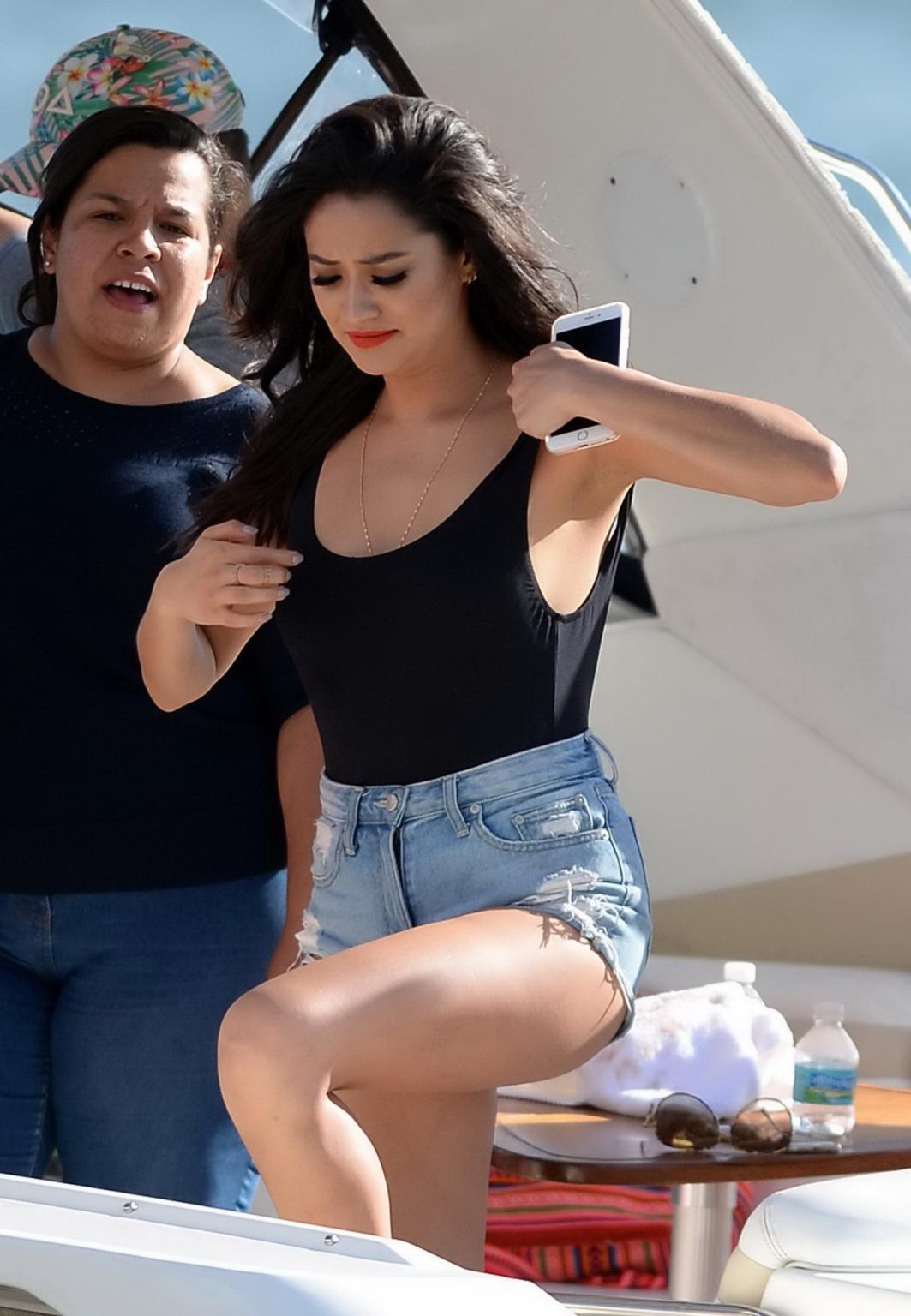 16P Shay Mitchell busty in black swimsuit and denim shorts