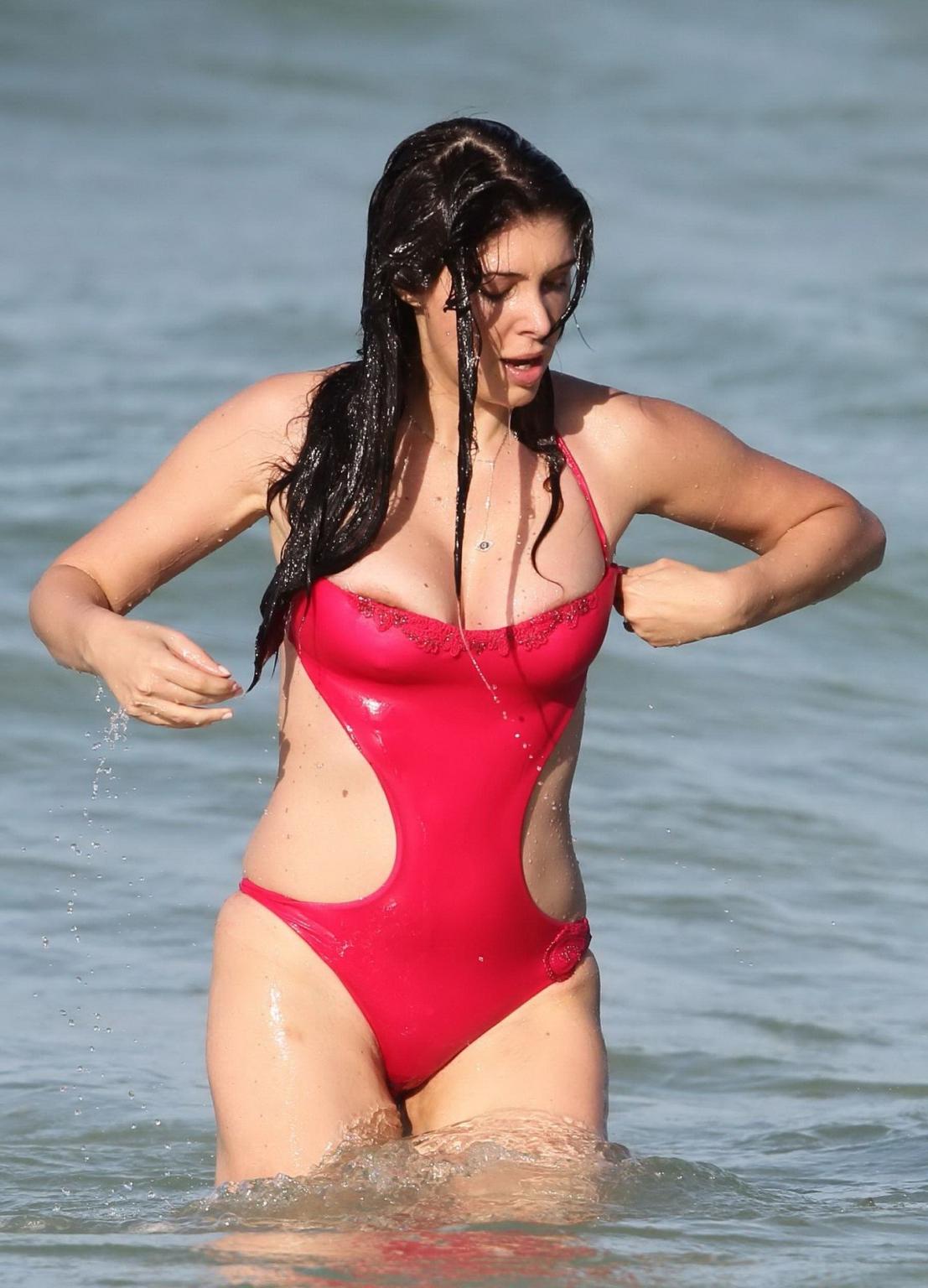 16P Brittny Gastineau nipple slip in red swimsuit at the beach