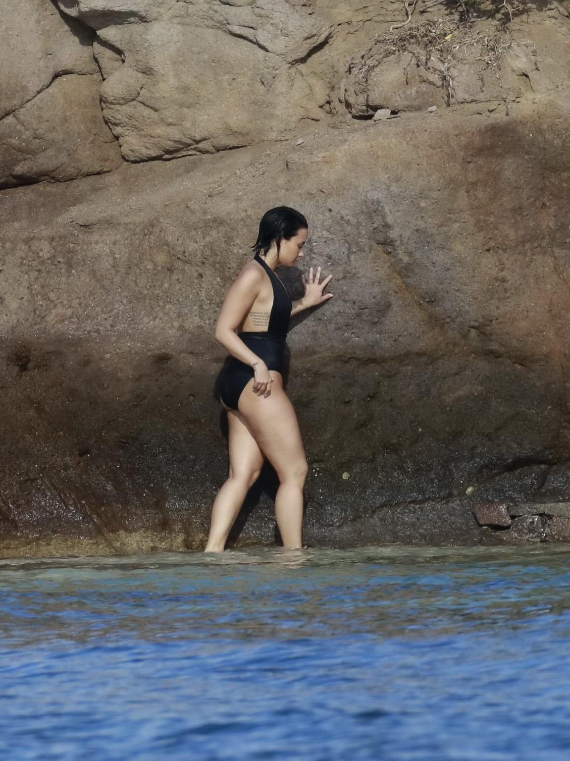 16P Demi Lovato showing her round ass in black swimsuit