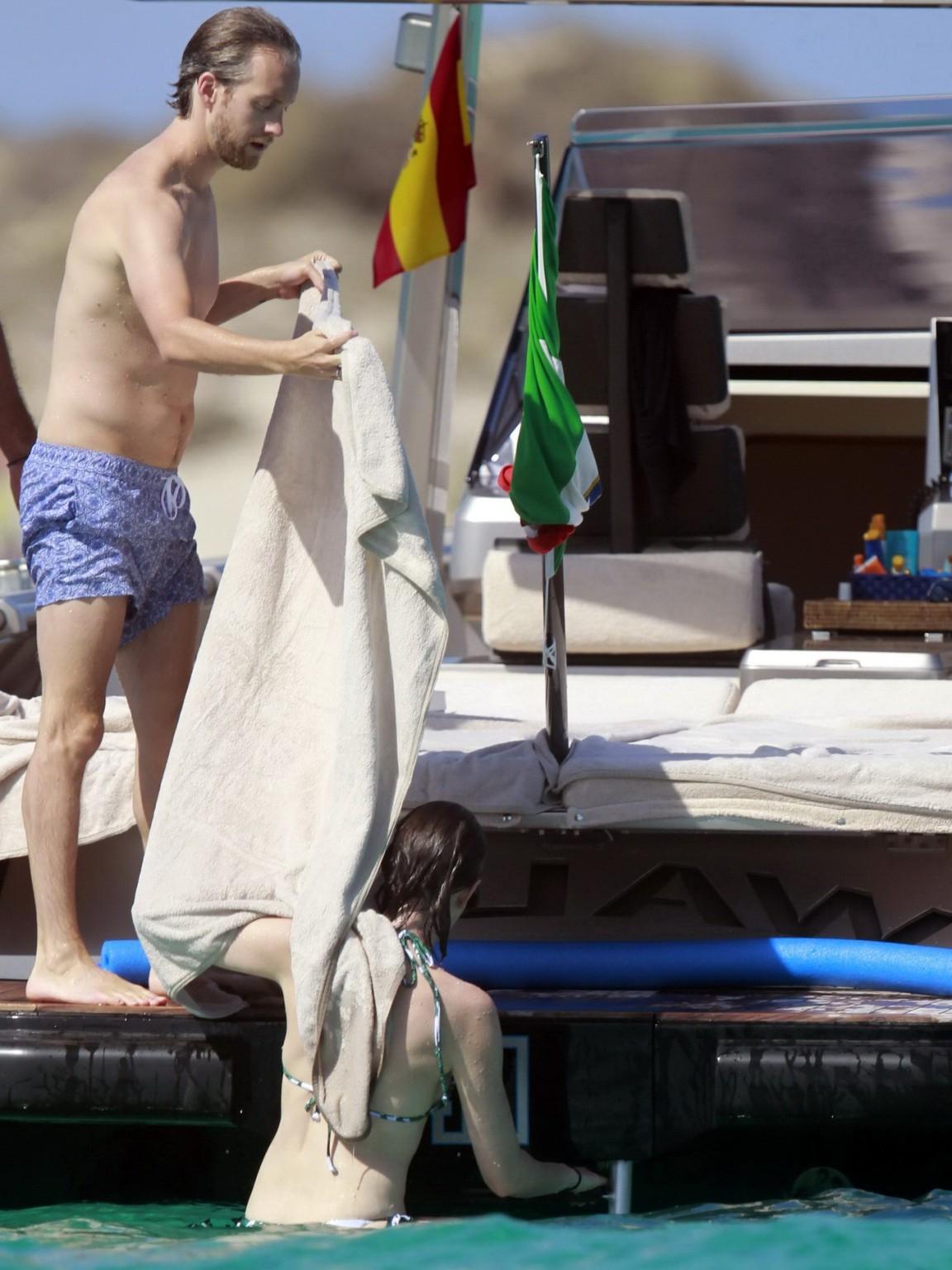 16P Anne Hathaway wearing bikini on a boat in Ibiza Spain