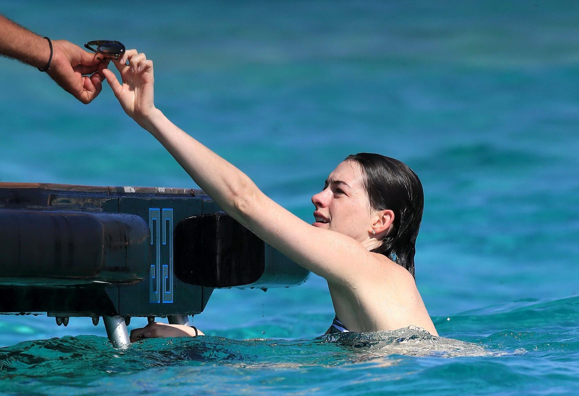 16P Anne Hathaway wearing bikini on a boat in Ibiza Spain