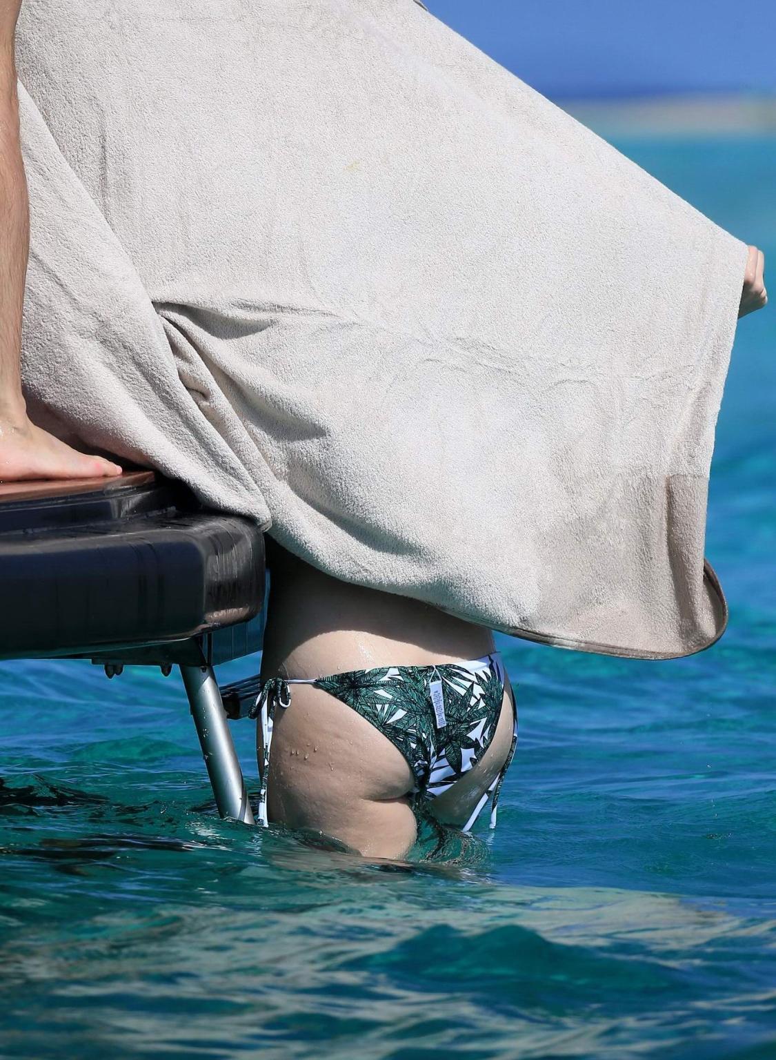 16P Anne Hathaway wearing bikini on a boat in Ibiza Spain