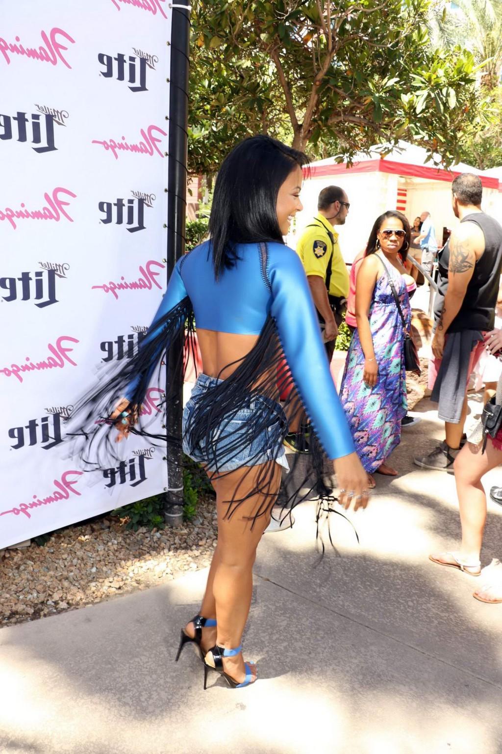 16P Christina Milian wearing swimsuit and hotpants