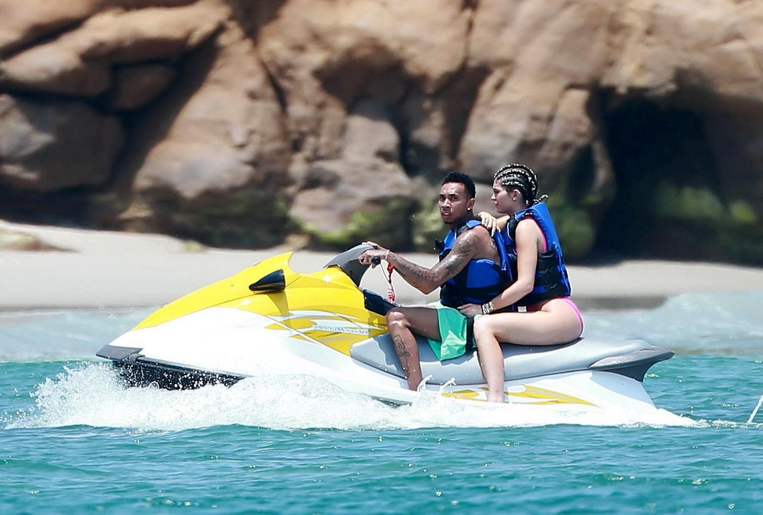 16P Kylie Jenner shows off her curvy body in a pink swimsuit