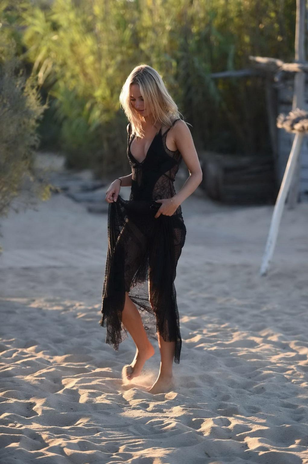 16P Kimberley Garner shows off her boobs and ass in tiny swimsuit