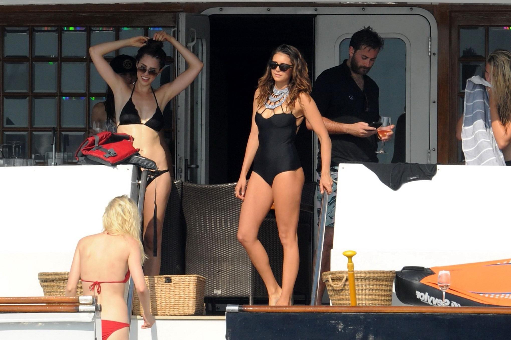 16P Nina Dobrev wearing a sexy black swimsuit on a yacht in St Tropez