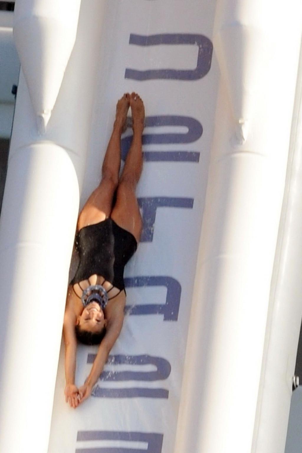 16P Nina Dobrev wearing a sexy black swimsuit on a yacht in St Tropez