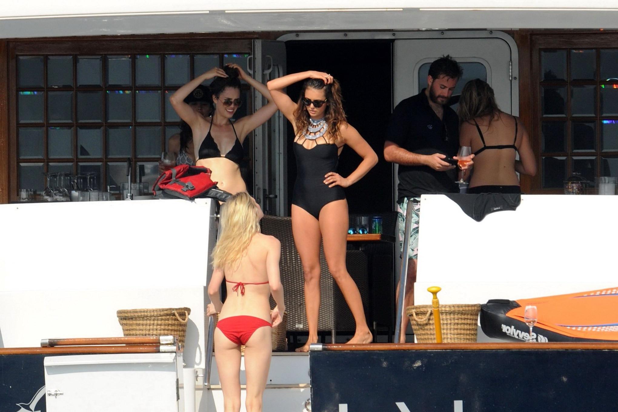 16P Nina Dobrev wearing a sexy black swimsuit on a yacht in St Tropez