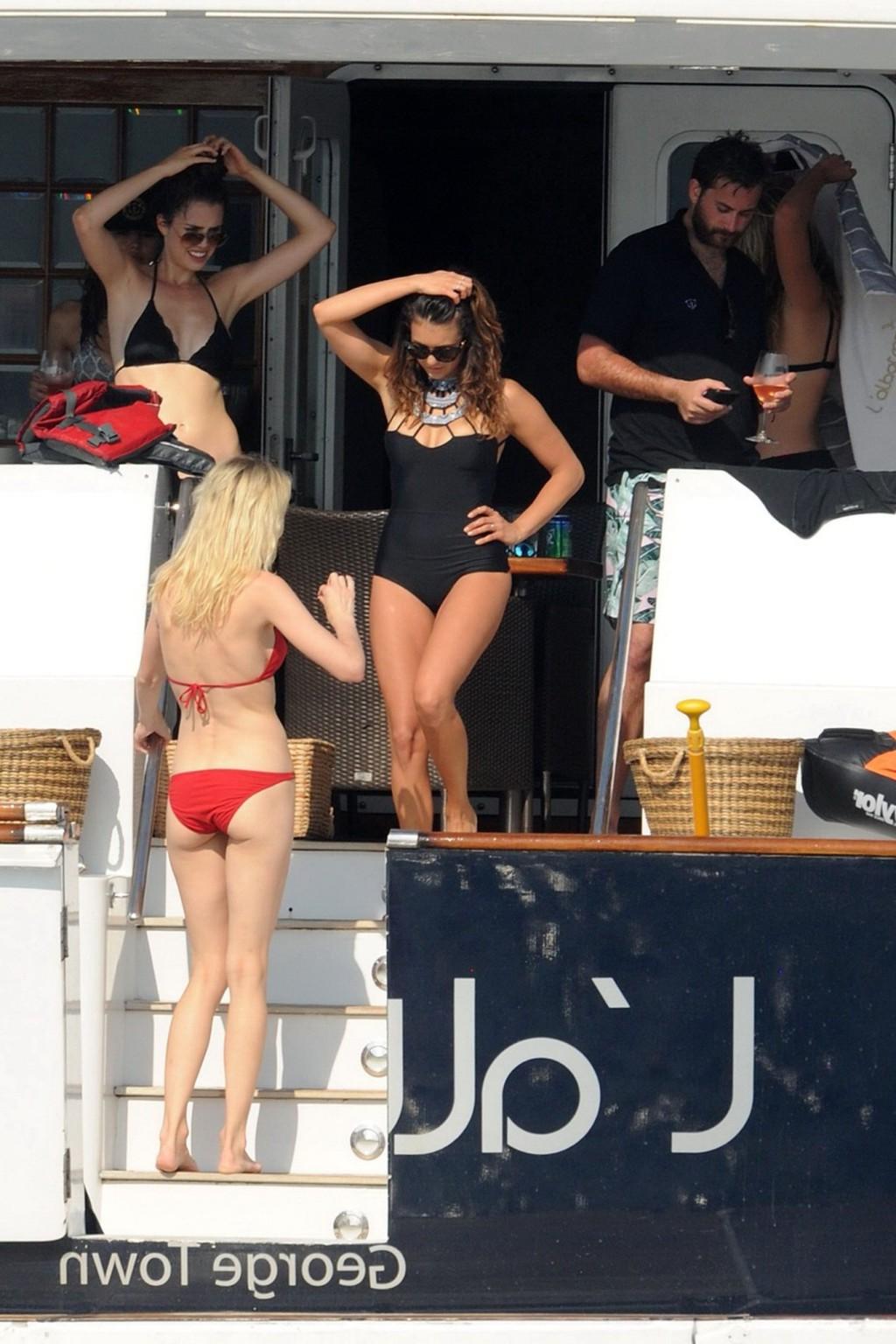 16P Nina Dobrev wearing a sexy black swimsuit on a yacht in St Tropez