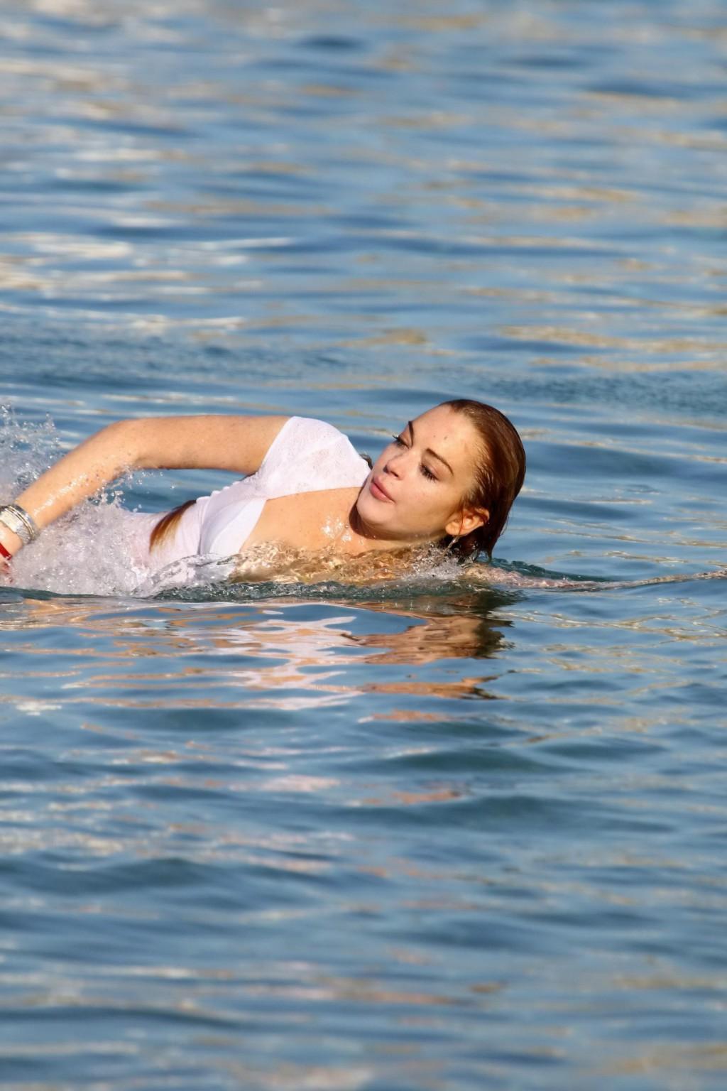 16P Lindsay Lohan busty in bizarre white seethrough swimsuit