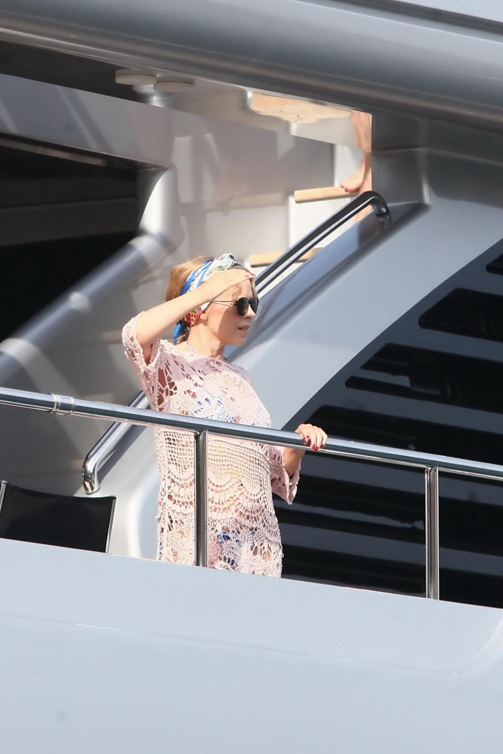 16P Kylie Minogue see through to blue bikini outdoor