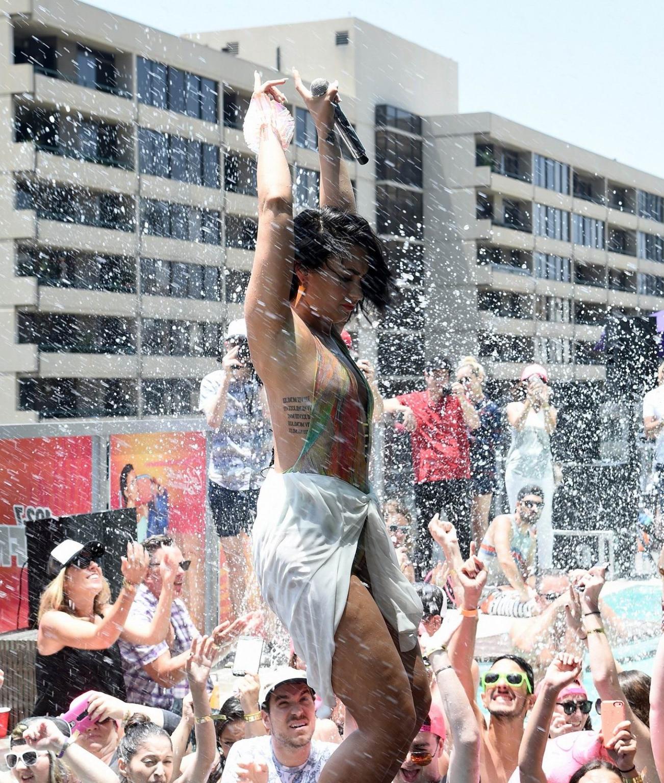 16P Demi Lovato getting wet in low cut swimsuit poolside