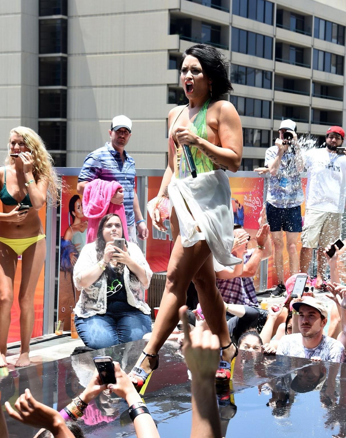 16P Demi Lovato getting wet in low cut swimsuit poolside