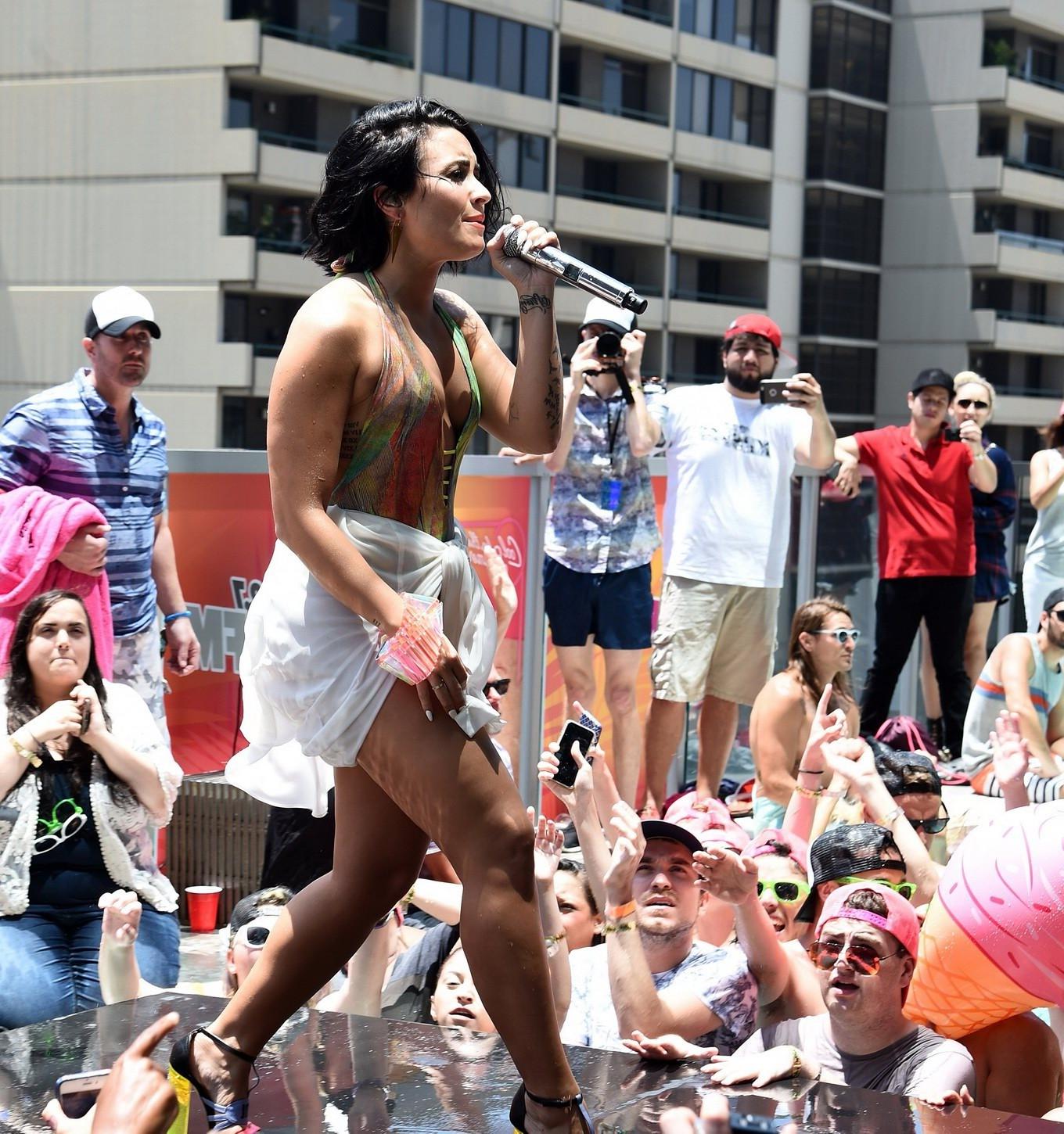 16P Demi Lovato getting wet in low cut swimsuit poolside