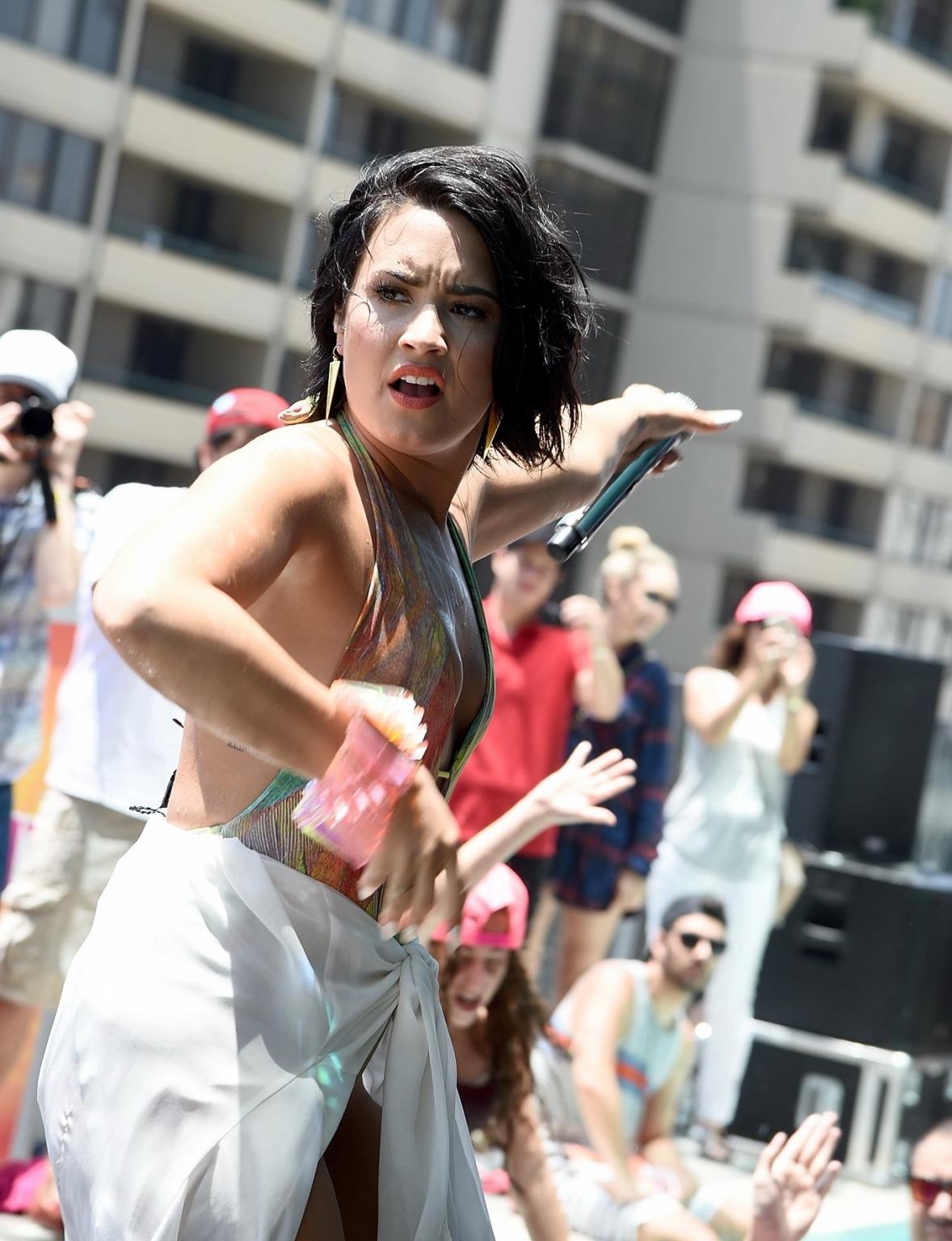 16P Demi Lovato getting wet in low cut swimsuit poolside