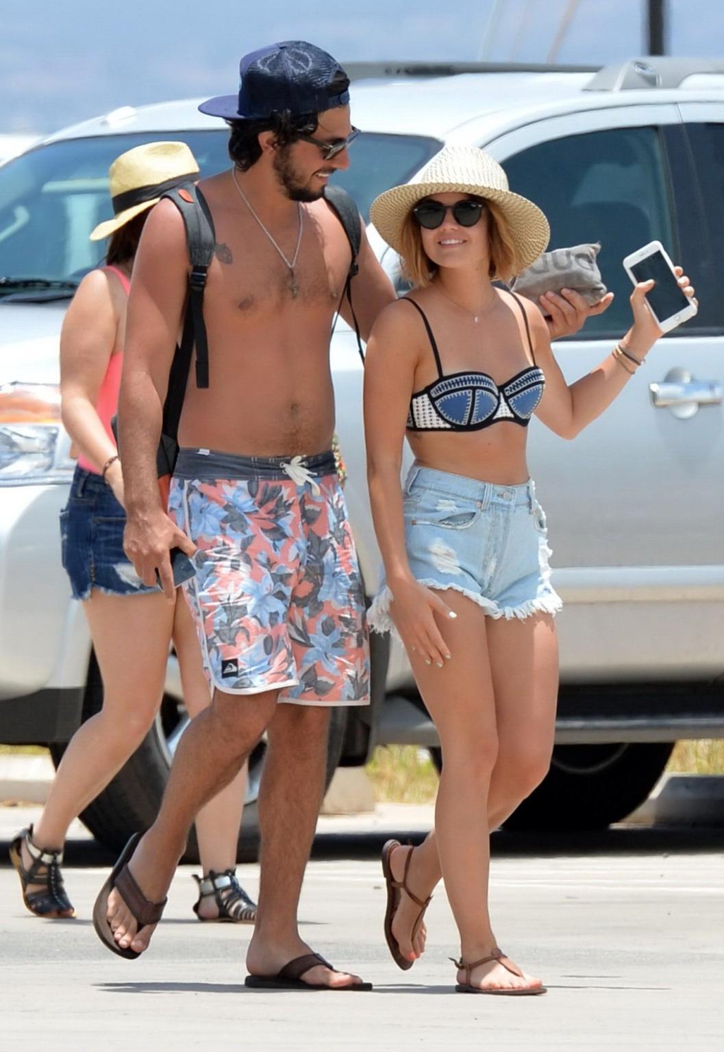 16P Lucy Hale showing off her bikini body on a Hawaiian beach