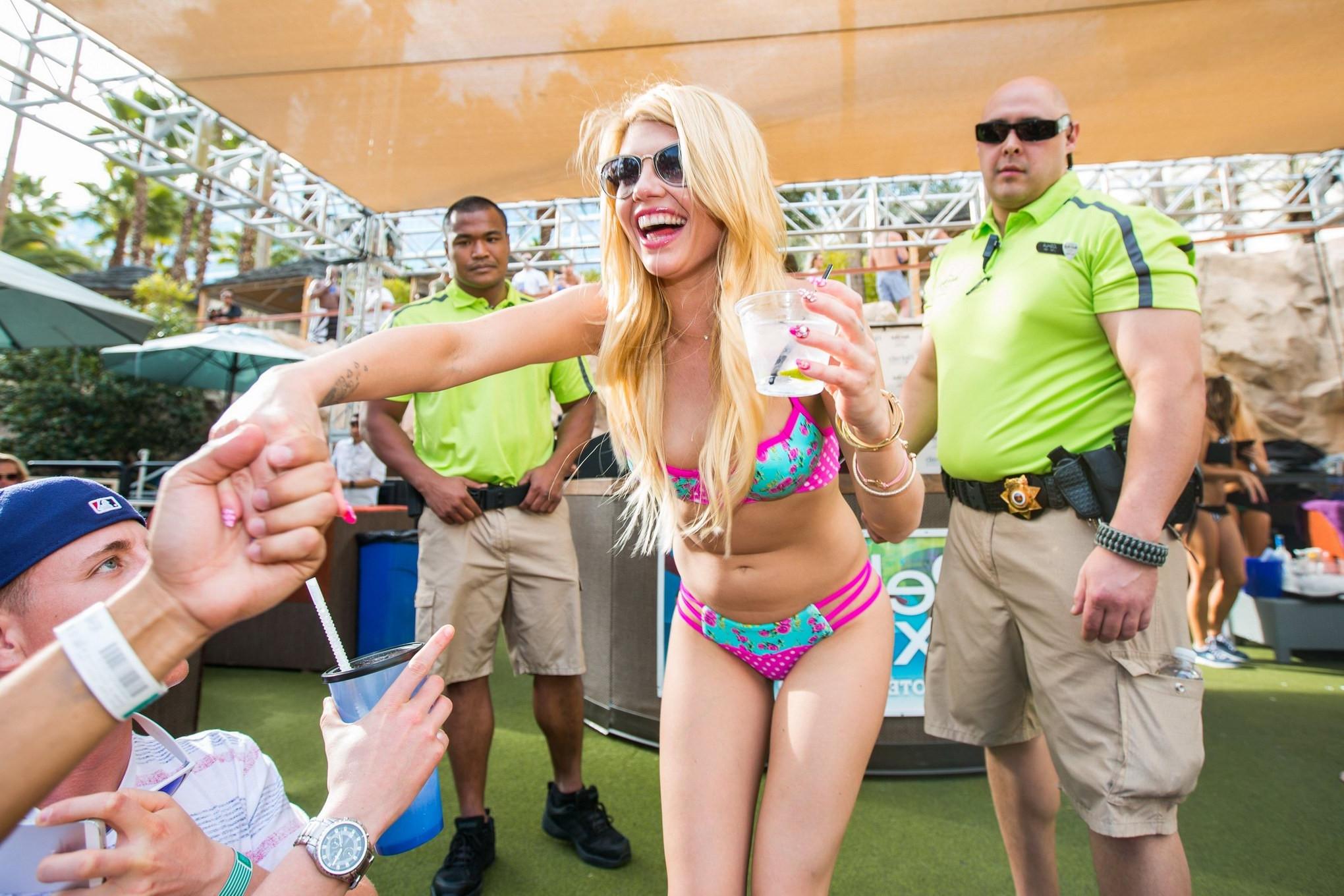16P Chanel West Coast exposing her hot body in a skimpy pink  blue bikini for Rehab 