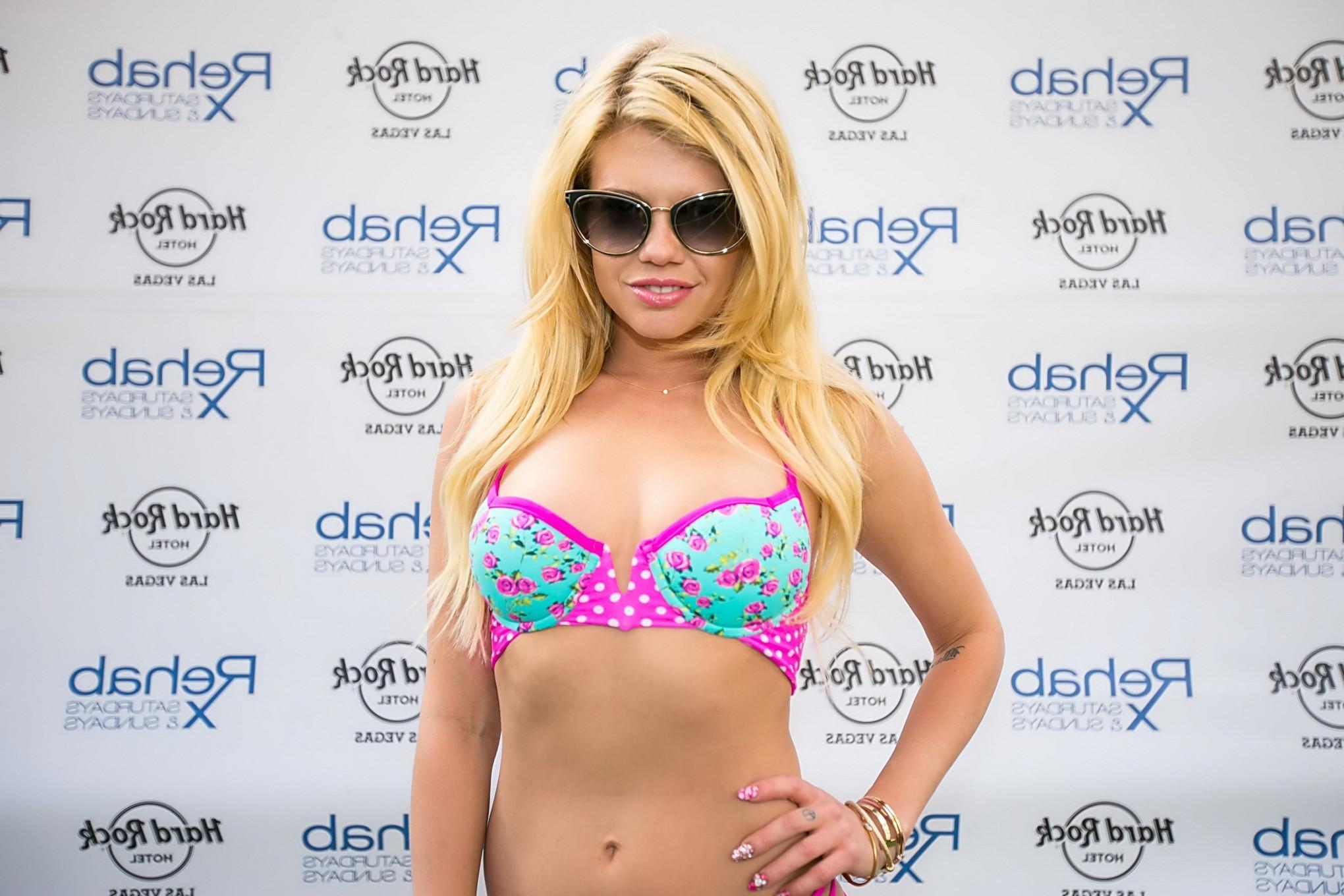 16P Chanel West Coast exposing her hot body in a skimpy pink  blue bikini for Rehab 