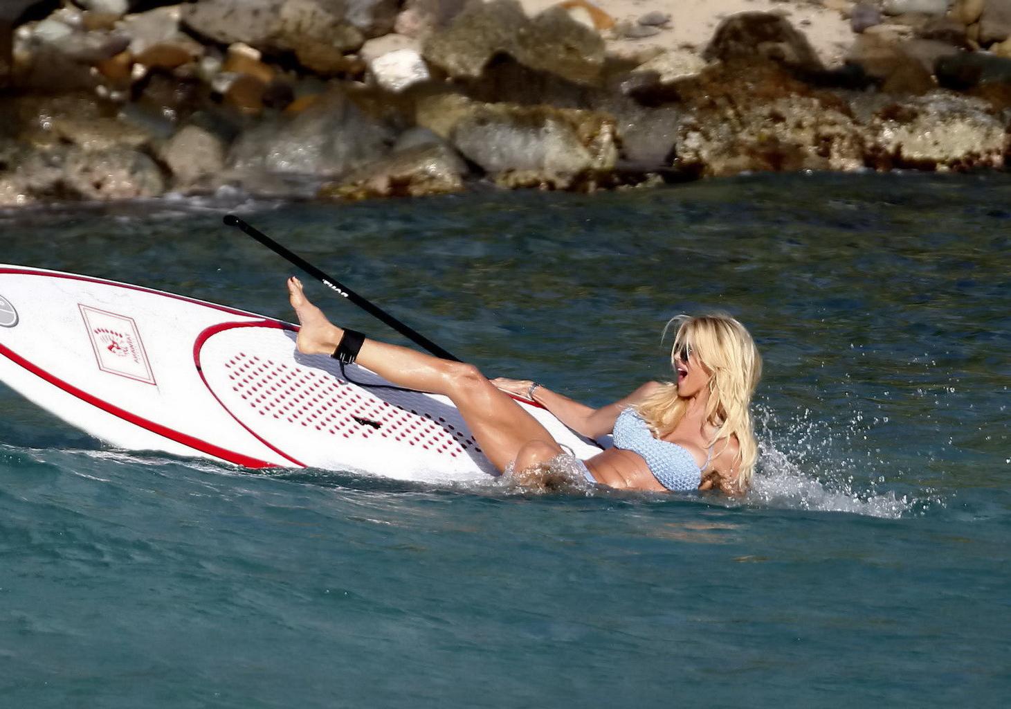 16P Victoria Silvstedt shows off her huge boobs and ass in a tiny blue bikini while 
