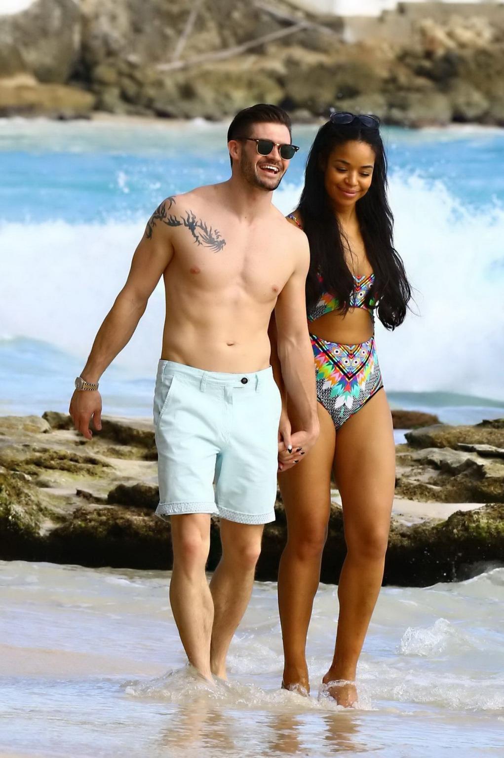 16P Sarah Jane Crawford shows off her seductive curves in a colorful swimsuit at the