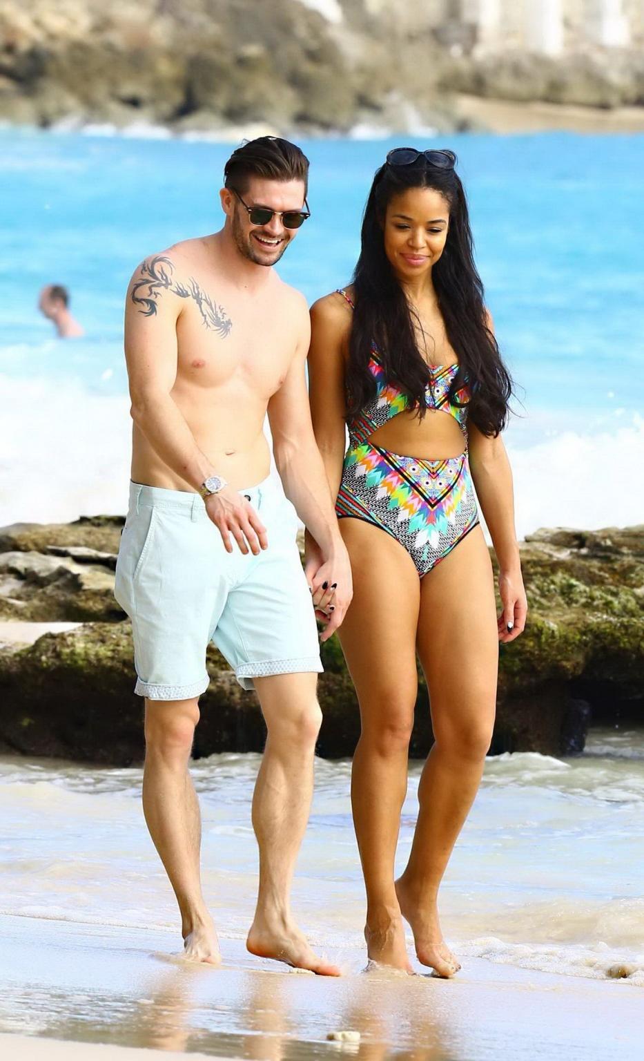 16P Sarah Jane Crawford shows off her seductive curves in a colorful swimsuit at the