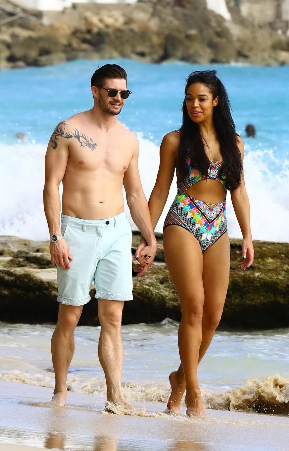 16P Sarah Jane Crawford shows off her seductive curves in a colorful swimsuit at the