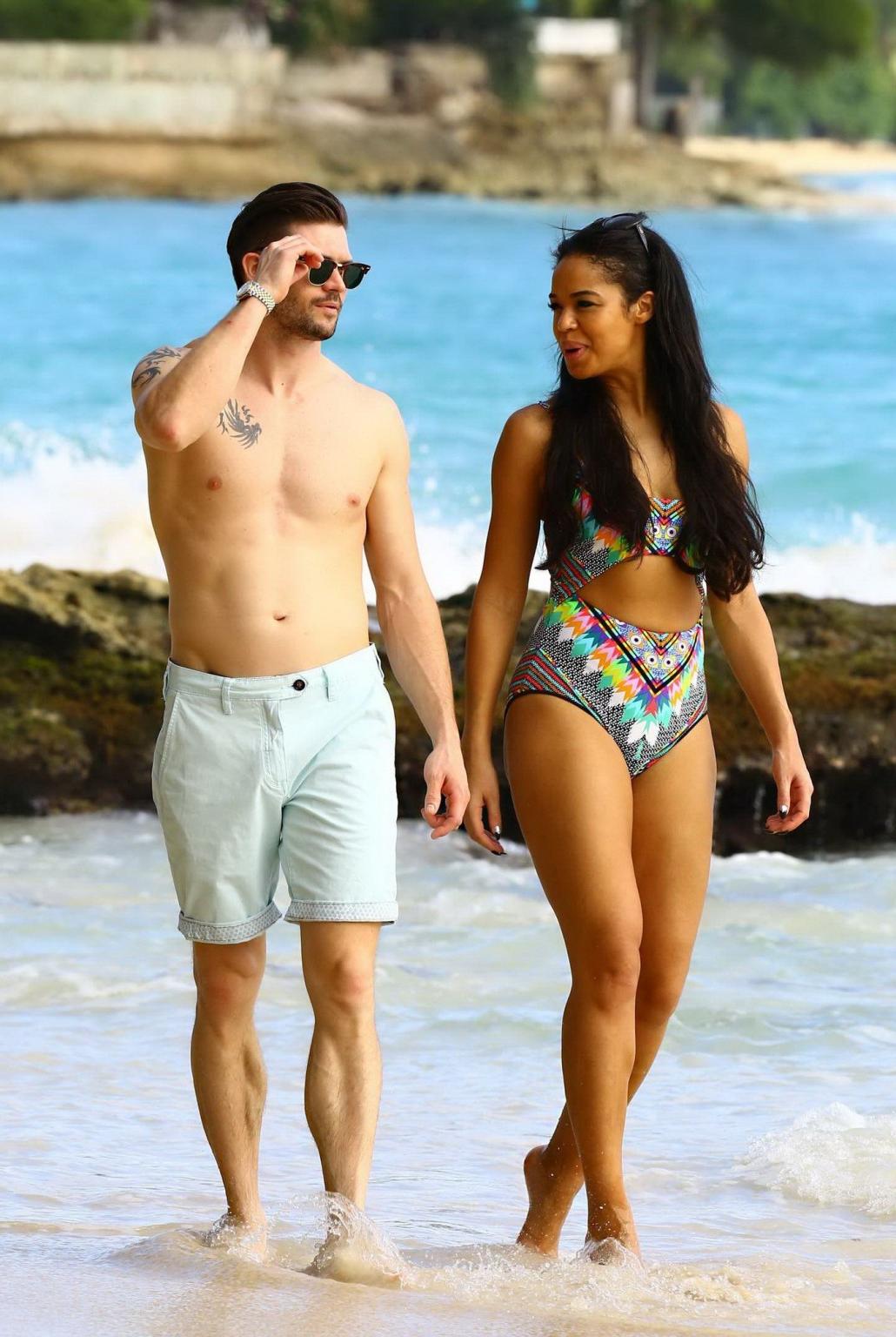 16P Sarah Jane Crawford shows off her seductive curves in a colorful swimsuit at the