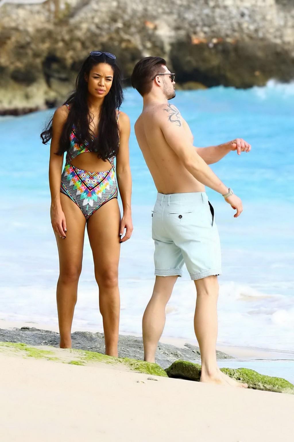 16P Sarah Jane Crawford shows off her seductive curves in a colorful swimsuit at the