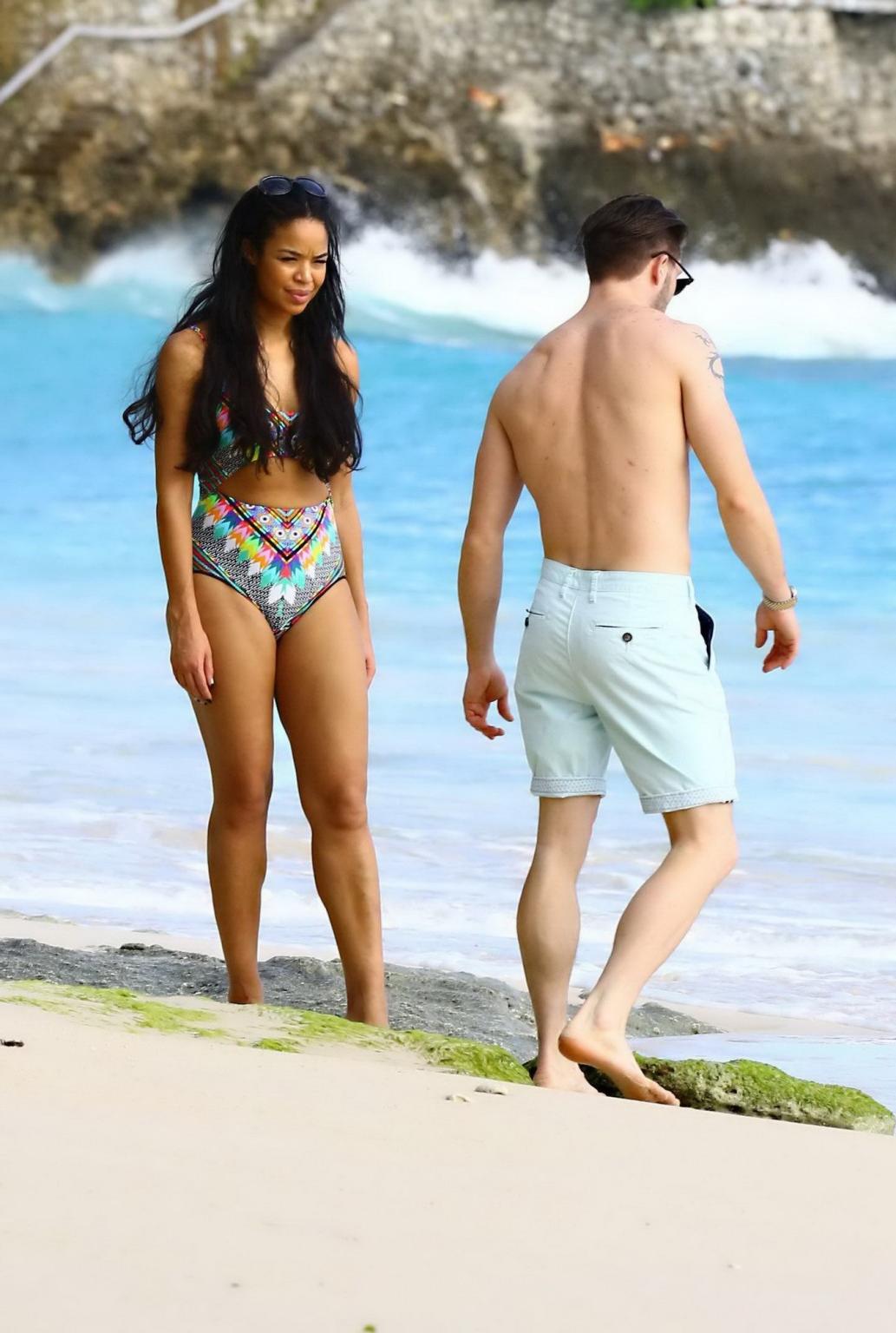 16P Sarah Jane Crawford shows off her seductive curves in a colorful swimsuit at the