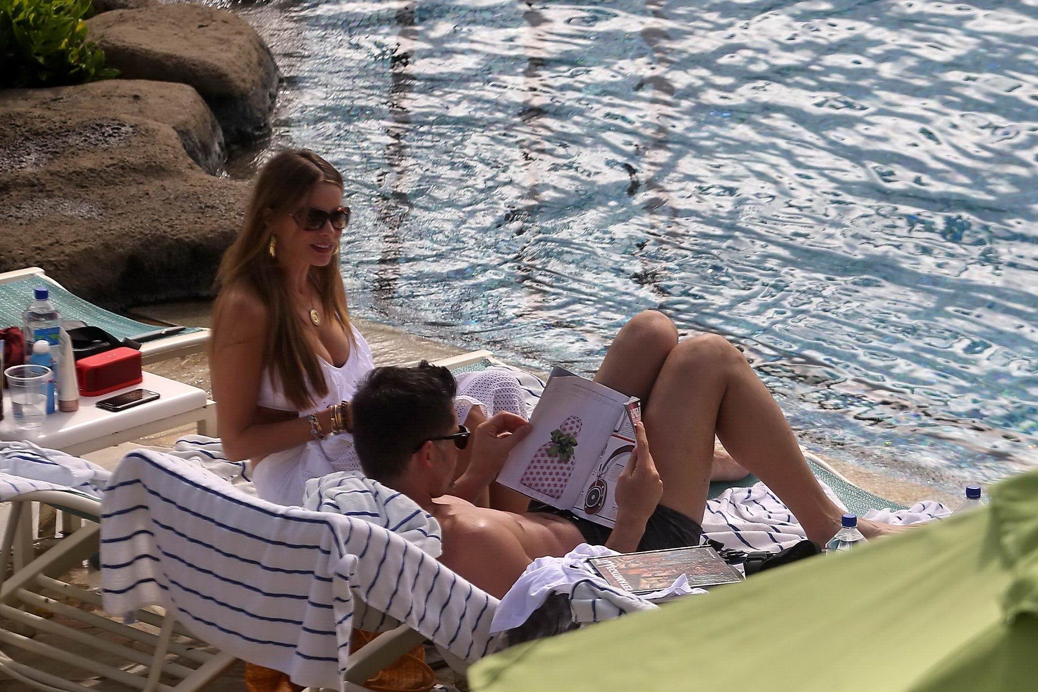 16P Busty Sofia Vergara wearing a skimpy white swimsuit poolside in Hawaii