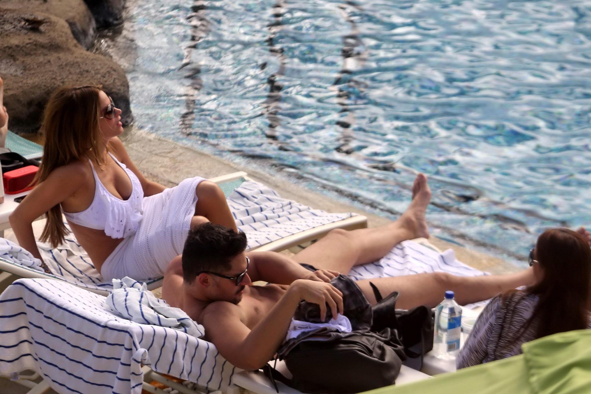16P Busty Sofia Vergara wearing a skimpy white swimsuit poolside in Hawaii