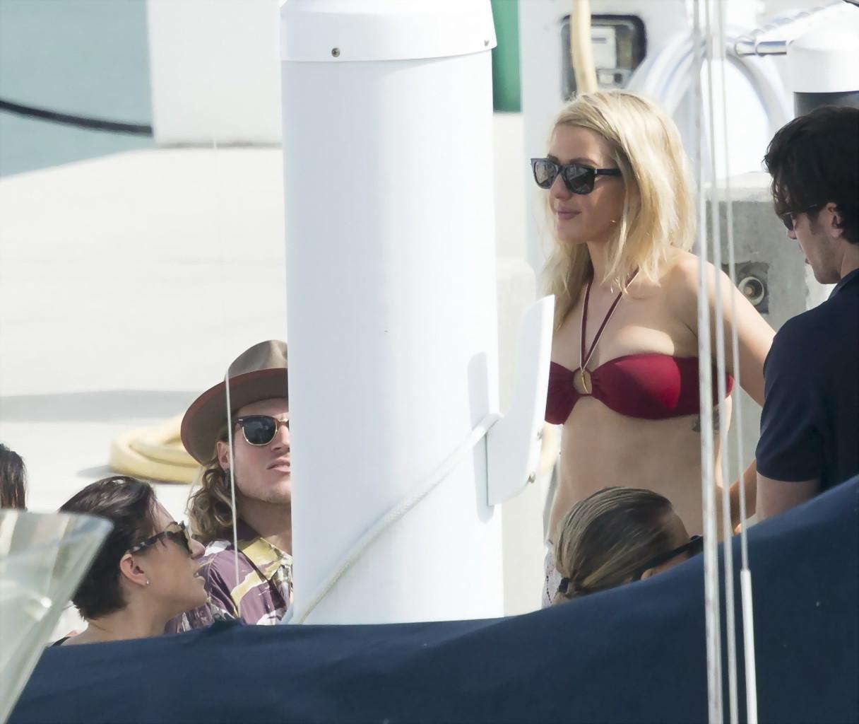 16P Ellie Goulding showing her ass in skimpy cherry colored bikini at the boat in Mi