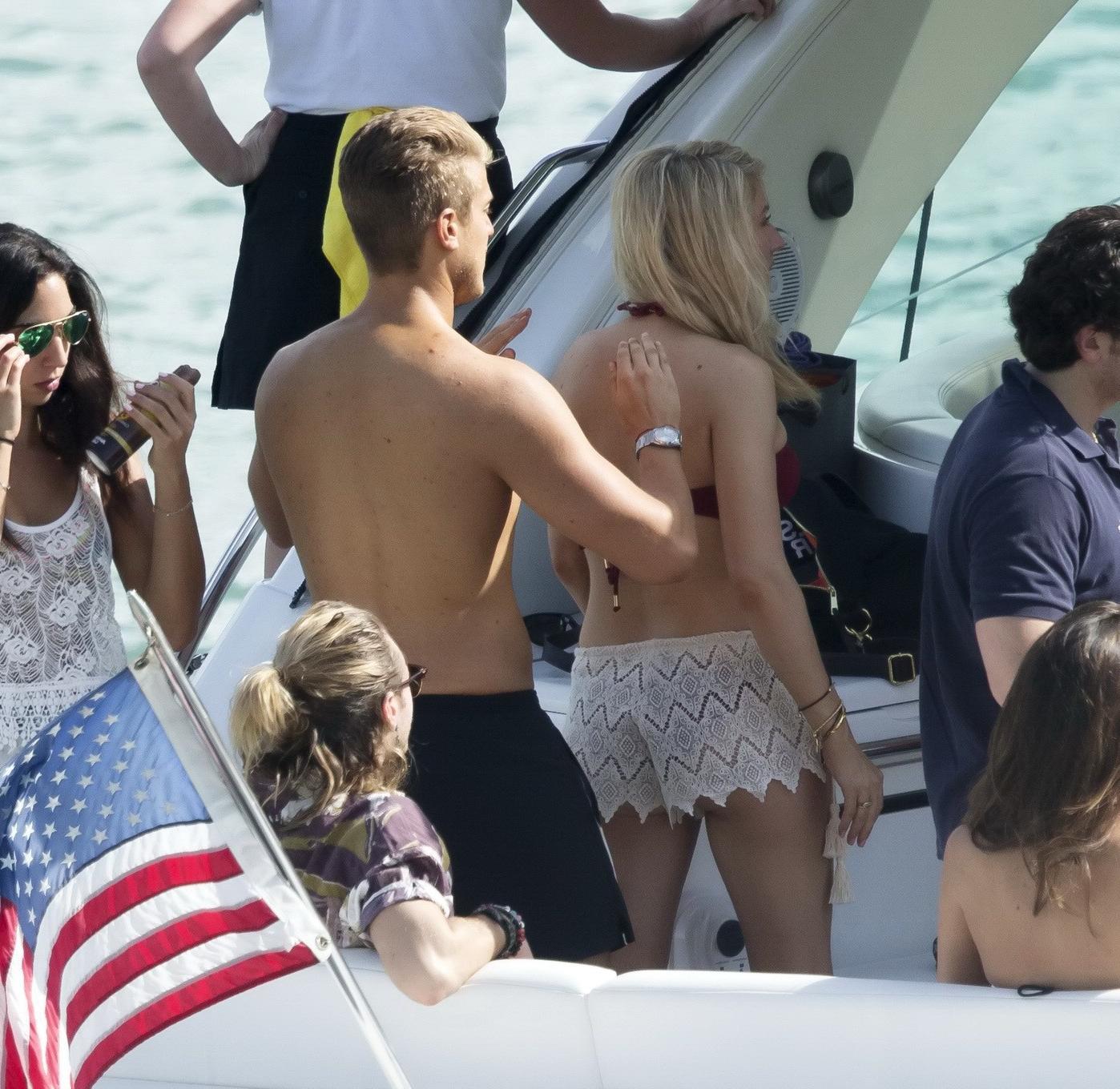 16P Ellie Goulding showing her ass in skimpy cherry colored bikini at the boat in Mi