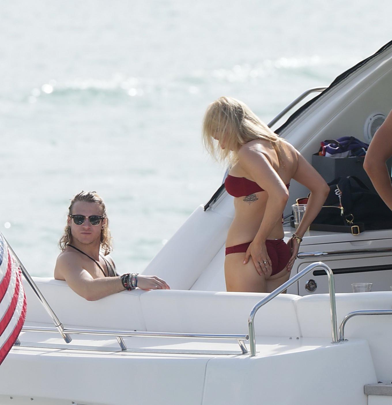 16P Ellie Goulding showing her ass in skimpy cherry colored bikini at the boat in Mi