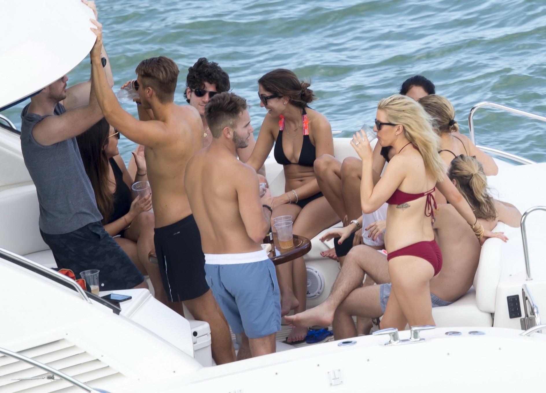 16P Ellie Goulding showing her ass in skimpy cherry colored bikini at the boat in Mi