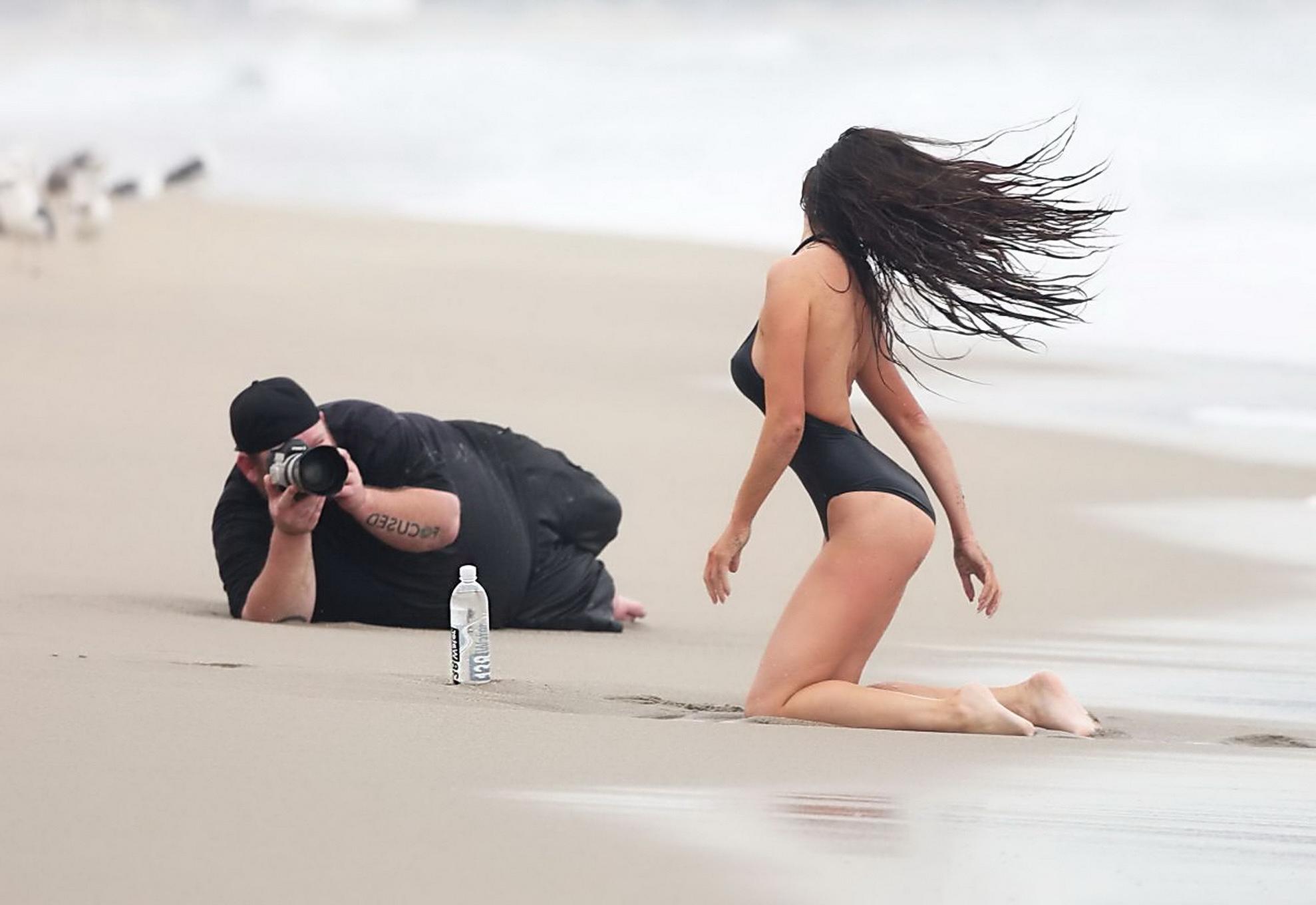 16P Kayla Swift shows sideboob and pokies in black swimsuit while freezing on the be