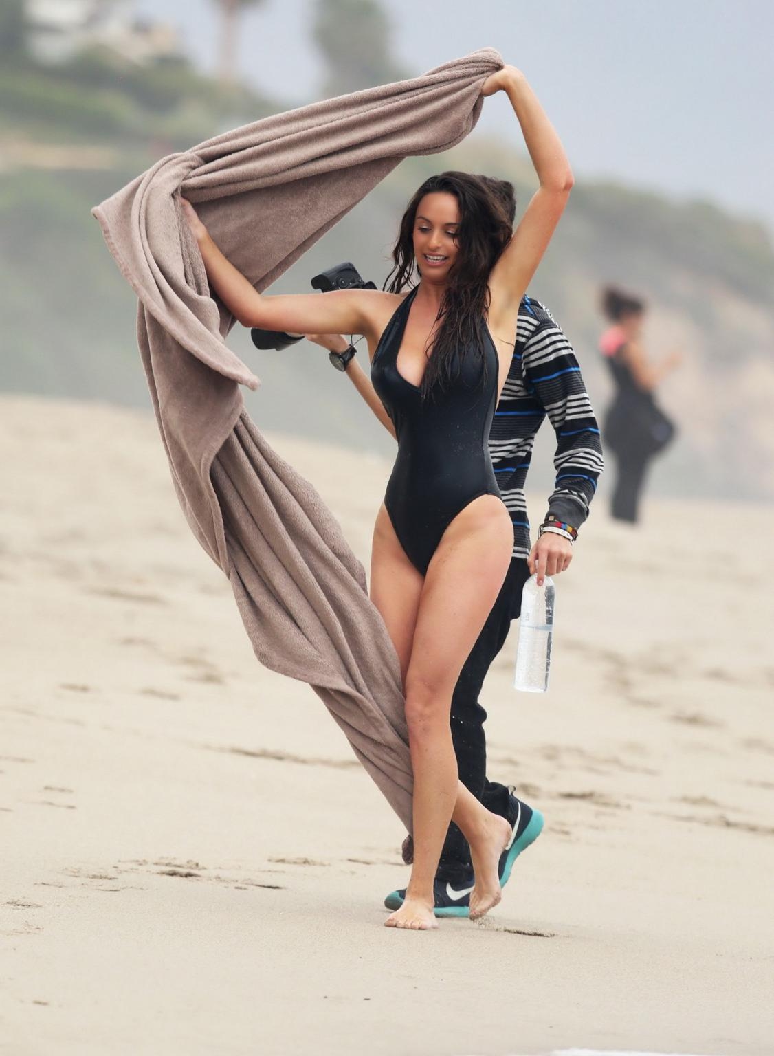 16P Kayla Swift shows sideboob and pokies in black swimsuit while freezing on the be